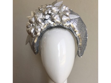 For Rent: Silver sequence crown finished with leather flowers